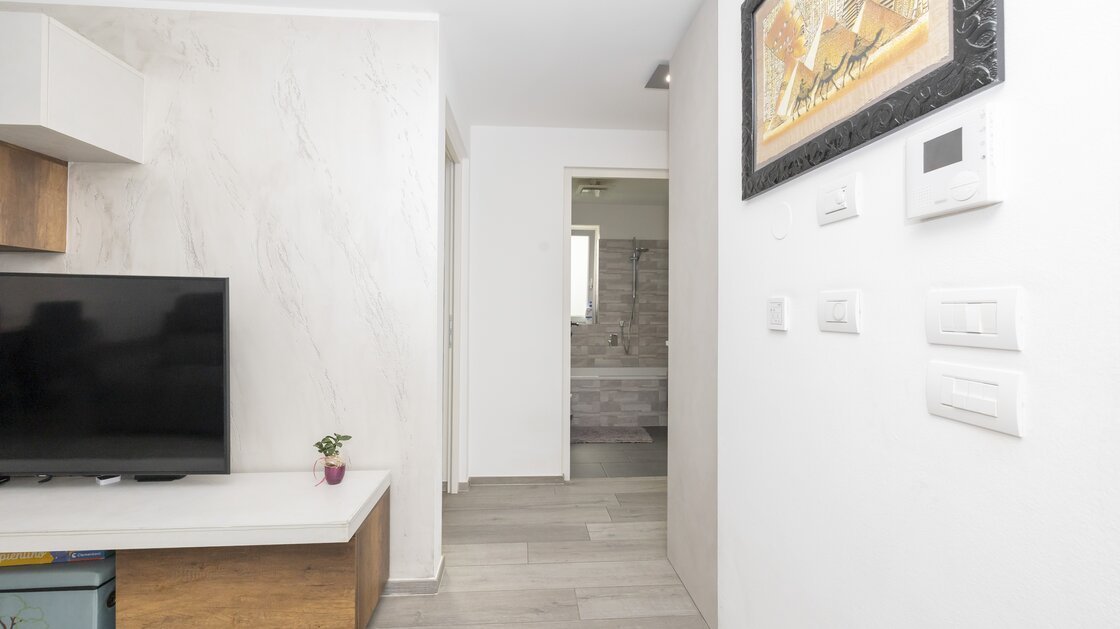 Neuwertige Dreizimmerwohnung mit Privatgarten in zentraler Lage