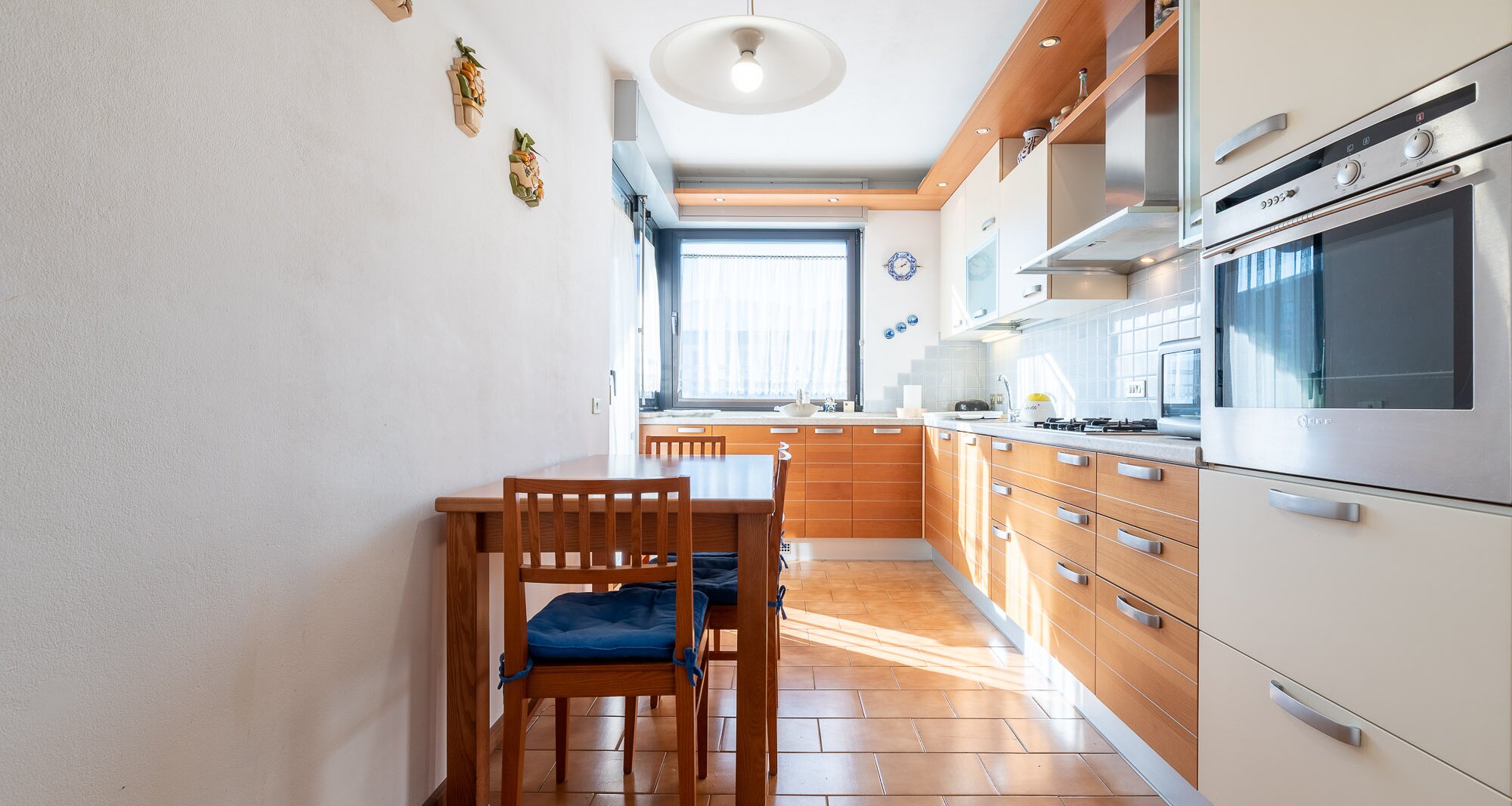 Ampio quadrilocale con terrazza e vista libera, piano alto