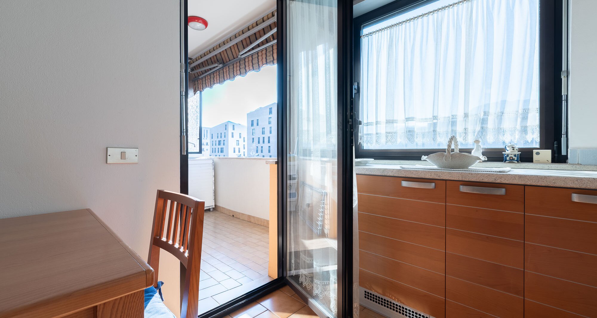 Ampio quadrilocale con terrazza e vista libera, piano alto