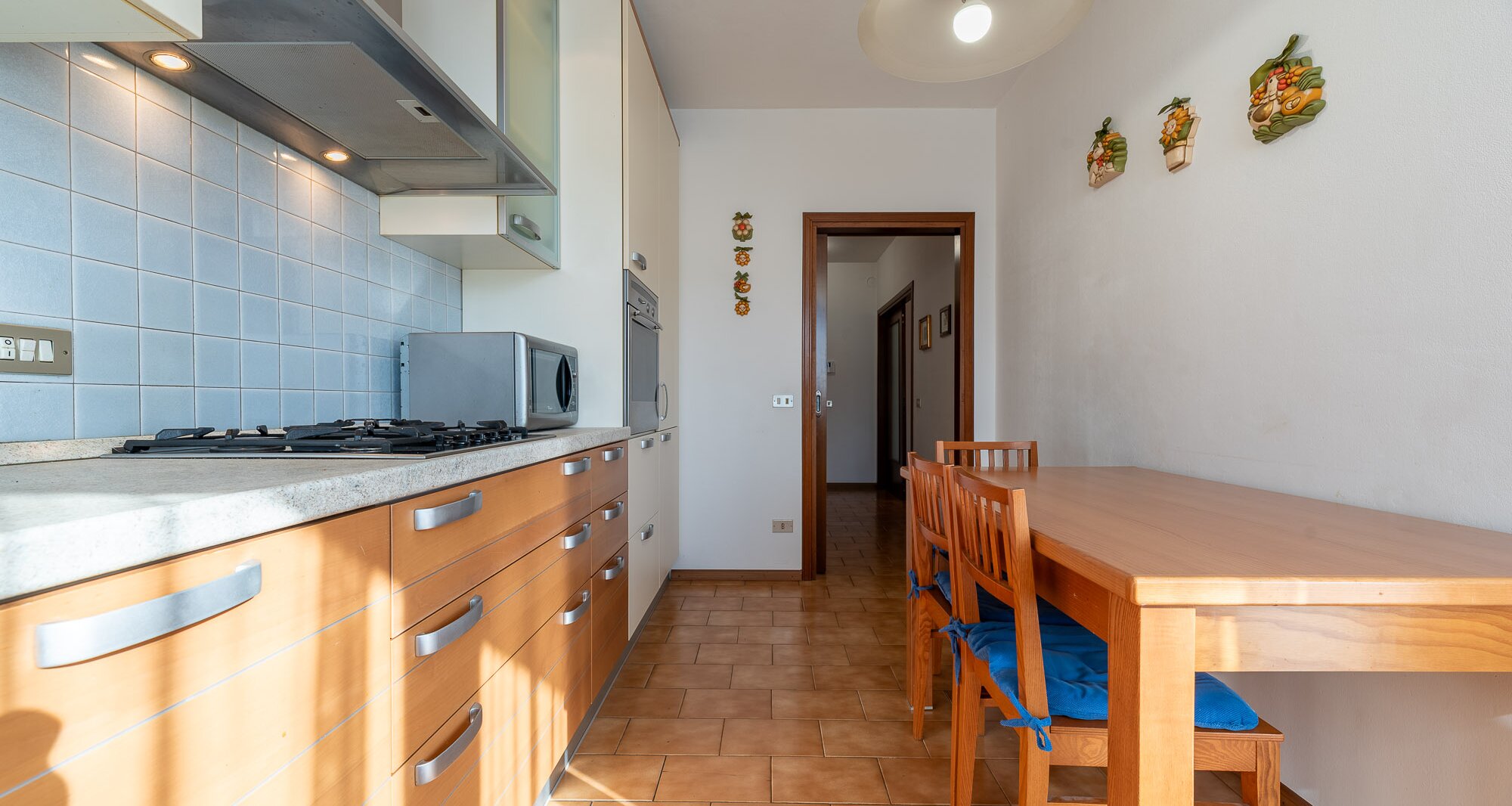 Ampio quadrilocale con terrazza e vista libera, piano alto