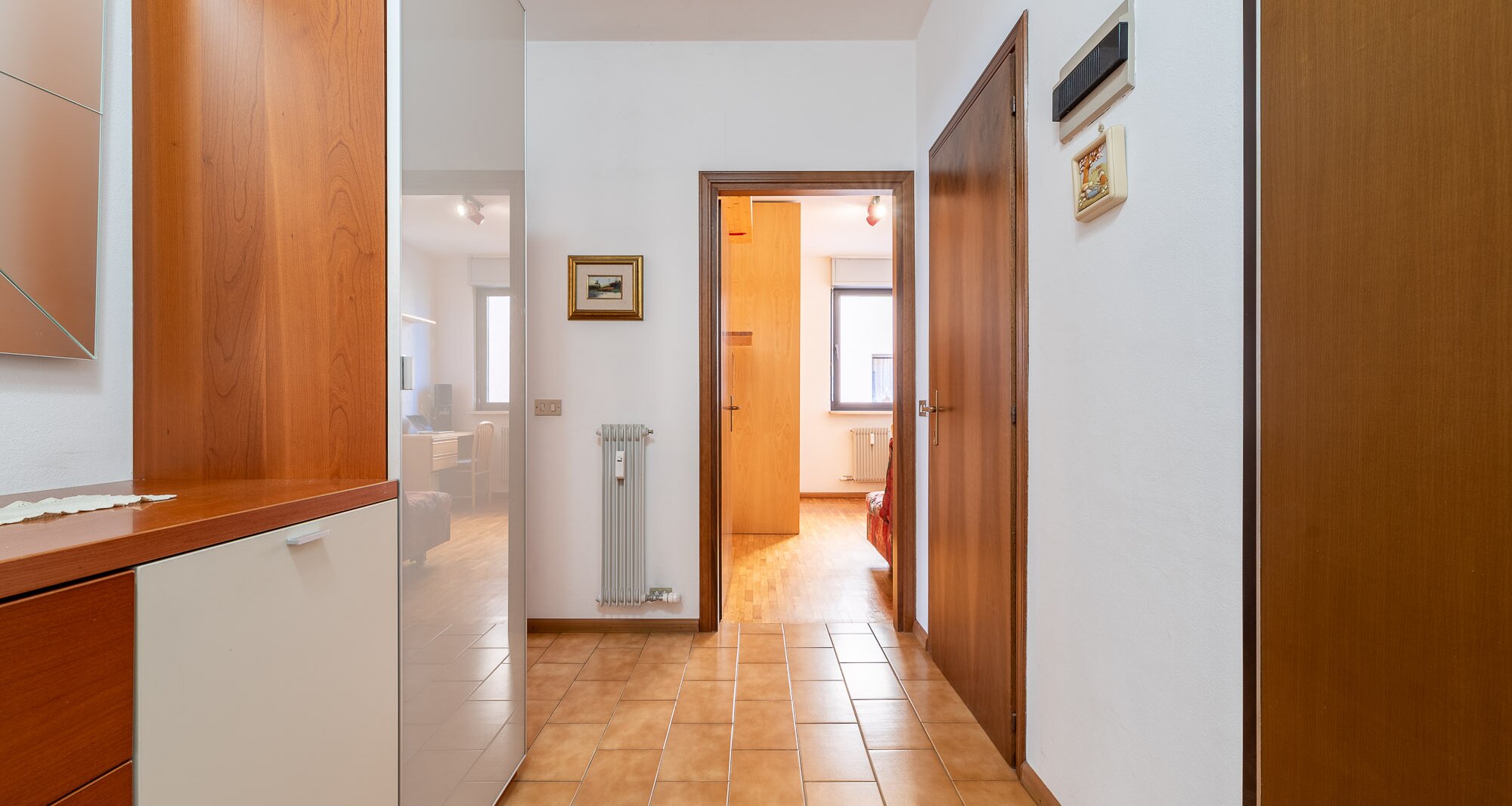 Ampio quadrilocale con terrazza e vista libera, piano alto