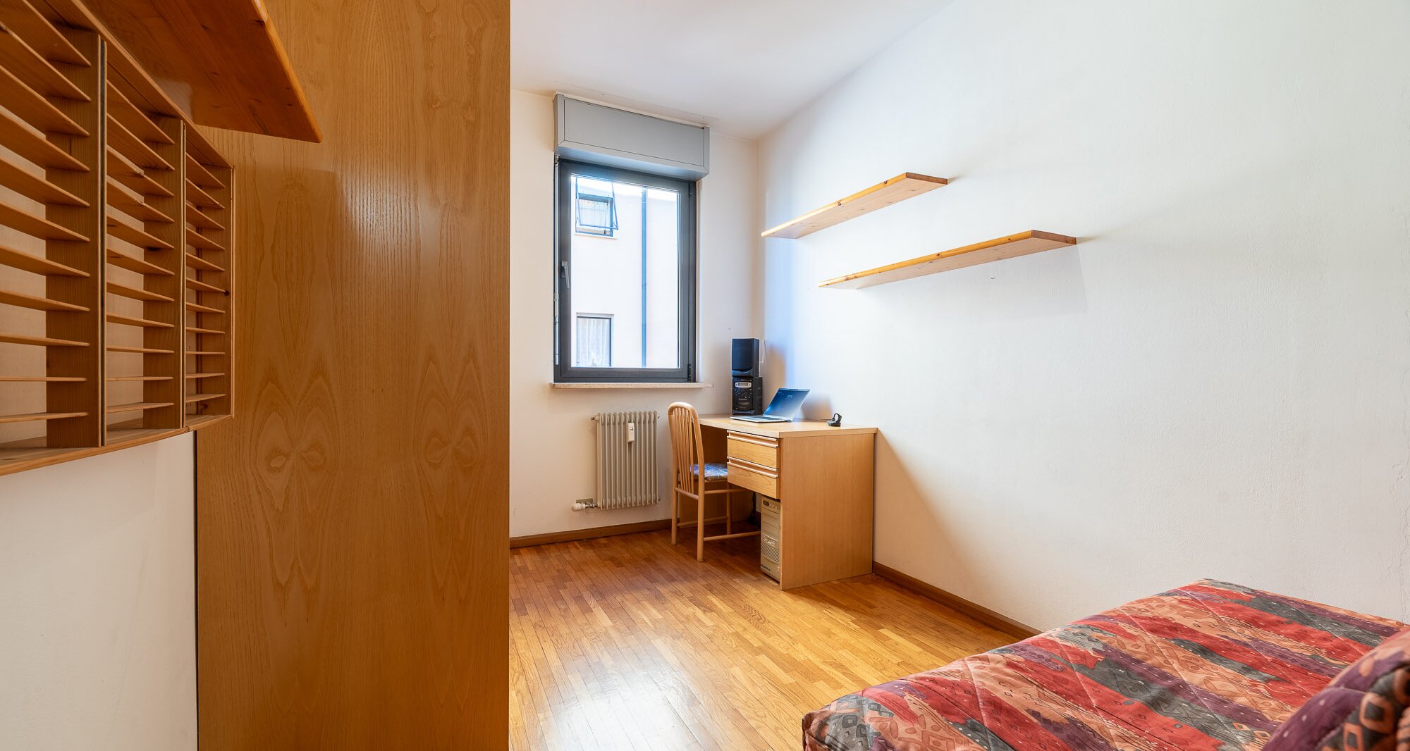 Ampio quadrilocale con terrazza e vista libera, piano alto