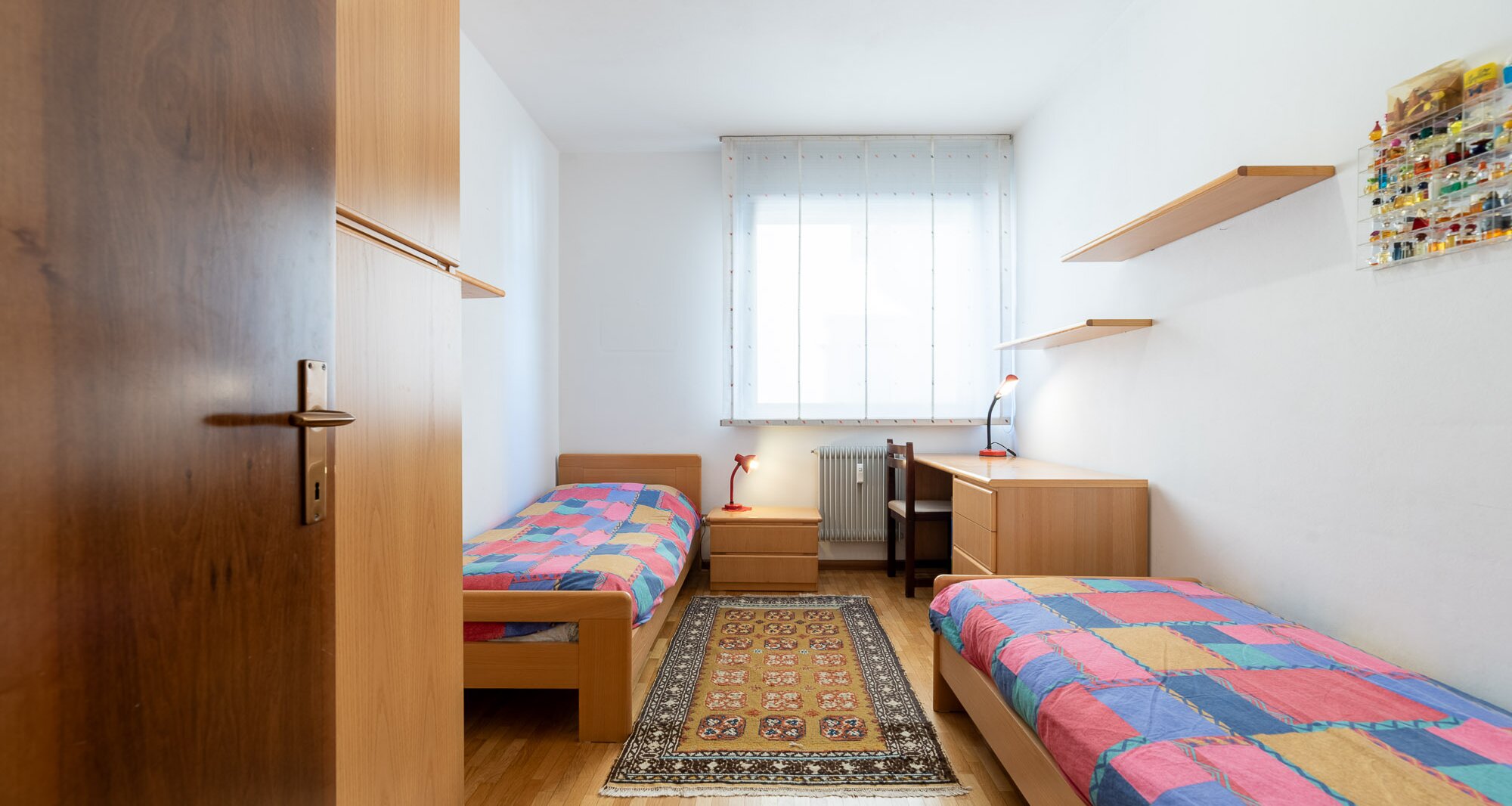 Ampio quadrilocale con terrazza e vista libera, piano alto