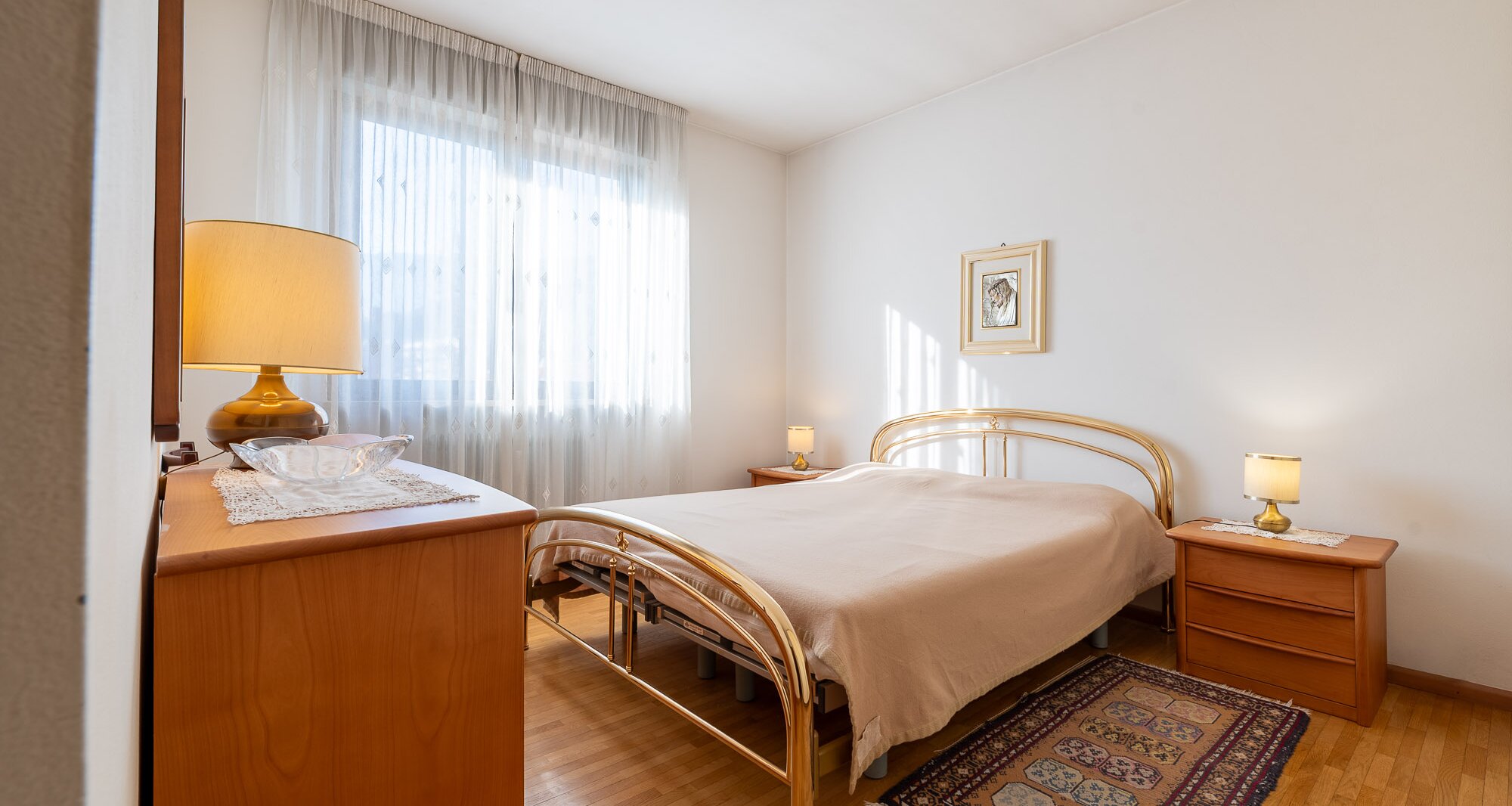 Ampio quadrilocale con terrazza e vista libera, piano alto